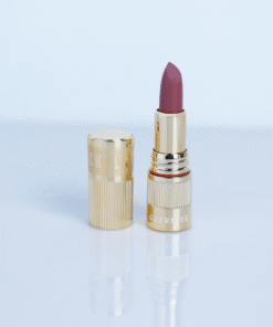 Guerniss soft burnt matte makeup holding lipstick